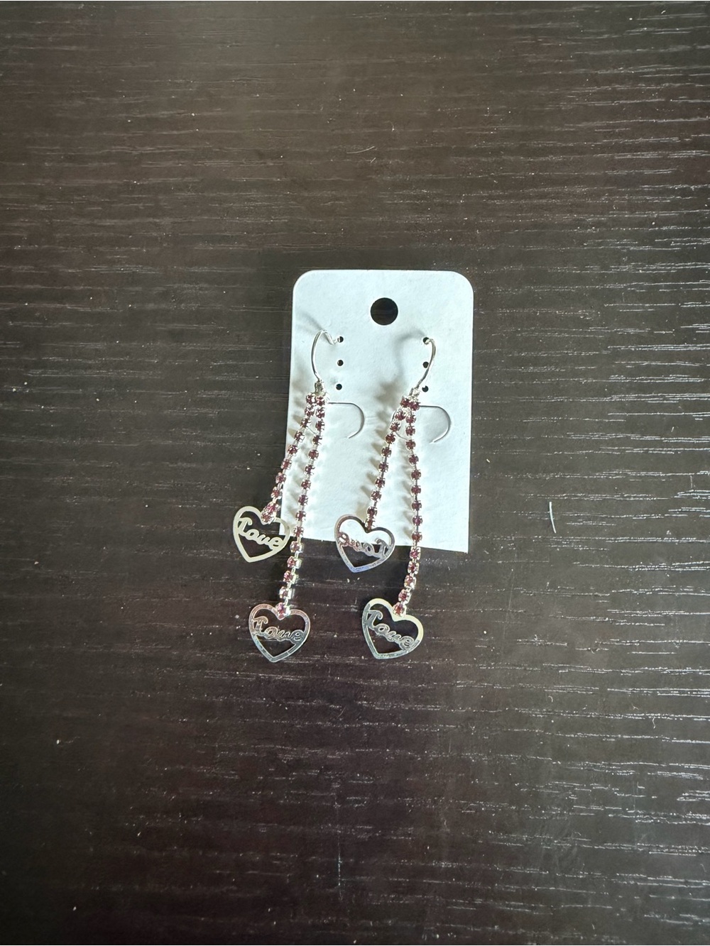 Silver-tone dangle earrings featuring red rhinestone strands